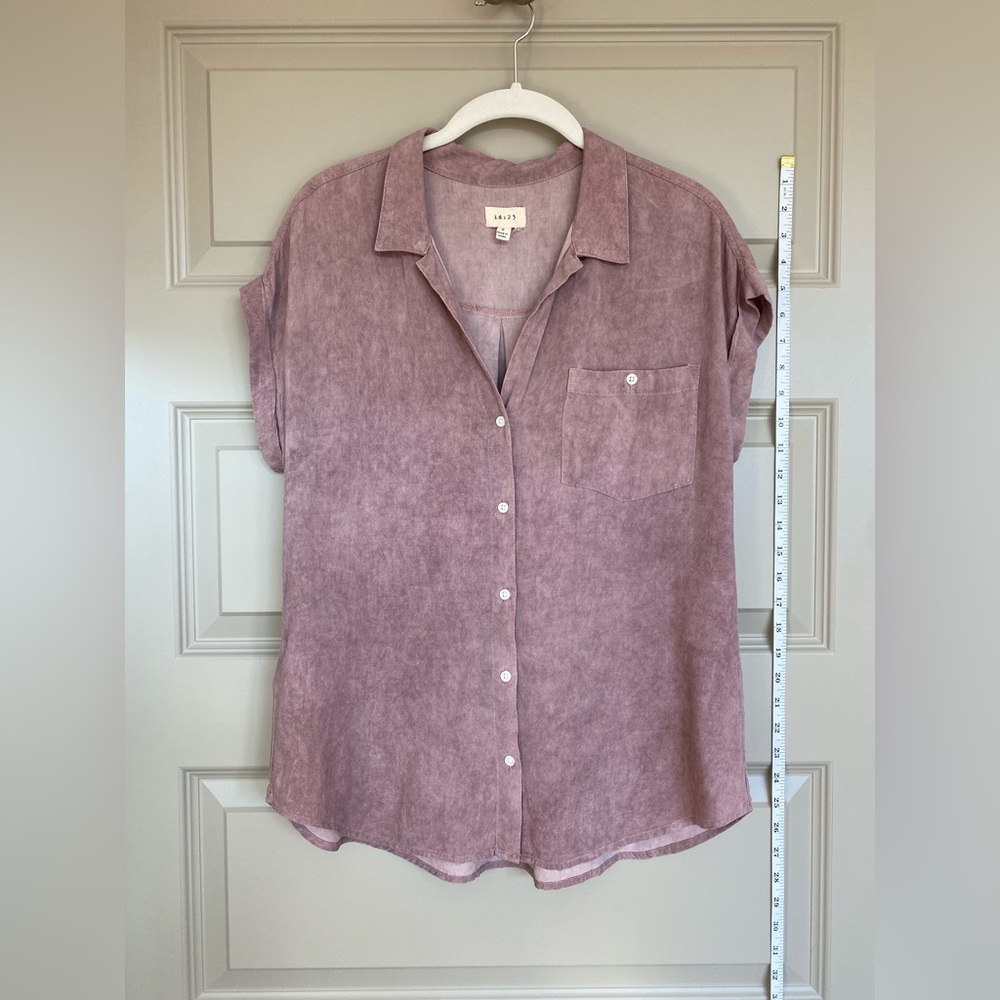 Light pink top. Cute tucked into cutoff jean shorts!